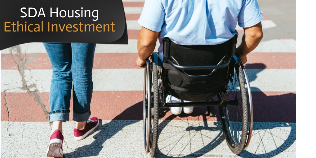women walking with man in wheelchair